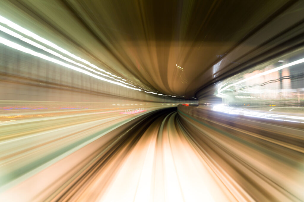 Fast train passing by train station